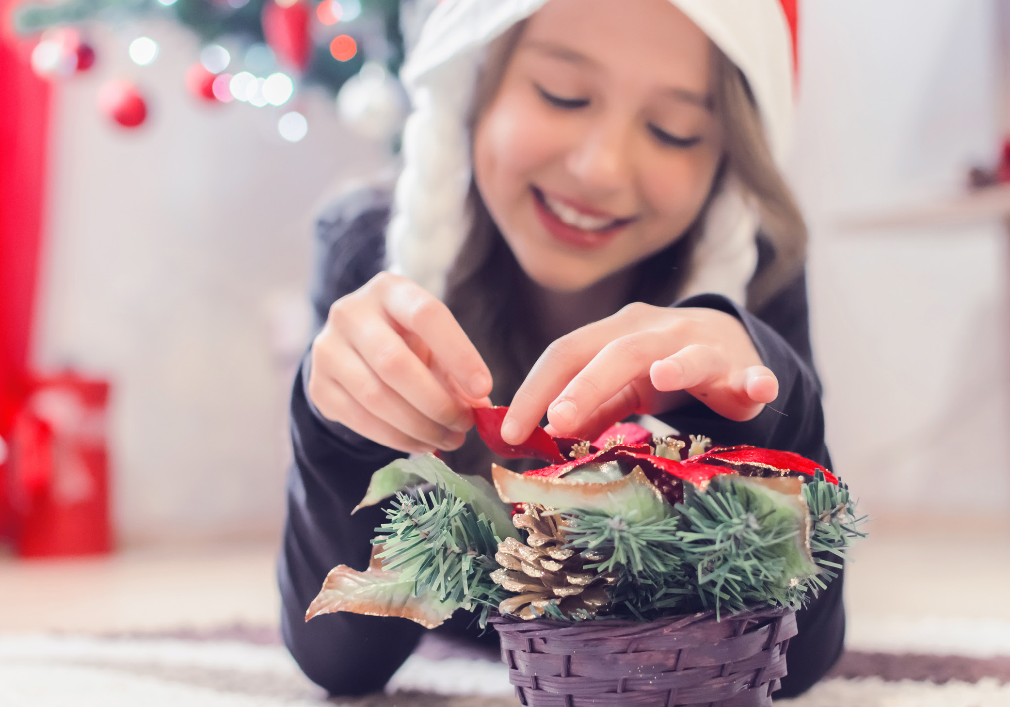 girl making DIY christmas decorations